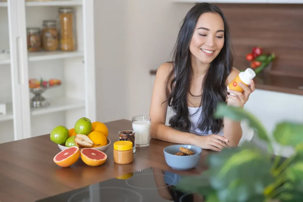 young woman taking vegan supplements for a healthy life.